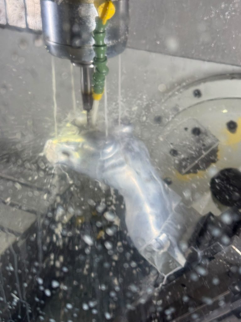 Precision CNC machining in progress on a complex aluminium component